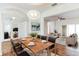 Bright dining room with a wood table and modern chandelier at 4901 Culdesac Ct, St Cloud, FL 34772