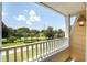 View from a balcony overlooking a beautifully landscaped area at 7509 Seven Eagles Way, Reunion, FL 34747