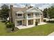 A two story home with balcony and a well manicured lawn at 7509 Seven Eagles Way, Reunion, FL 34747