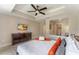 Main bedroom with king-size bed and open bathroom with a walk-in shower at 7509 Seven Eagles Way, Reunion, FL 34747