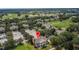 Aerial view of home and surrounding golf course community at 7509 Seven Eagles Way, Reunion, FL 34747