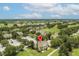Aerial view showcasing home location within community near golf course at 7509 Seven Eagles Way, Reunion, FL 34747
