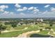 Aerial view of community, golf course, and resort amenities at 7509 Seven Eagles Way, Reunion, FL 34747