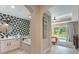 Spa-like bathroom with soaking tub and walk-in shower at 7509 Seven Eagles Way, Reunion, FL 34747
