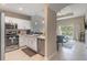 Modern kitchen with white cabinets and stainless steel appliances at 7509 Seven Eagles Way, Reunion, FL 34747
