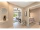 A hallway with access to a bedroom and a small bathroom at 7509 Seven Eagles Way, Reunion, FL 34747