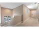 Upstairs hallway with neutral walls and tile flooring at 7509 Seven Eagles Way, Reunion, FL 34747