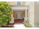 Inviting front entry with columns and a well-lit walkway at 7509 Seven Eagles Way, Reunion, FL 34747