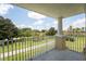 Private balcony overlooking lush landscaping at 7509 Seven Eagles Way, Reunion, FL 34747