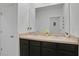 Double vanity bathroom with dark brown cabinets and beige countertop at 209 Sofia Ln, Lake Alfred, FL 33850