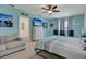 Main bedroom with king-size bed, sitting area, and large windows at 209 Sofia Ln, Lake Alfred, FL 33850
