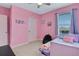 Pink bedroom with a daybed and closet at 209 Sofia Ln, Lake Alfred, FL 33850