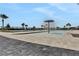 Community pool with mushroom water feature and lounge chairs at 209 Sofia Ln, Lake Alfred, FL 33850