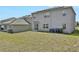 House with backyard, grassy area, and solar panels at 209 Sofia Ln, Lake Alfred, FL 33850