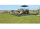 playground with shaded area near lake at 209 Sofia Ln, Lake Alfred, FL 33850