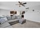 Living room with sectional sofa and view of kitchen at 209 Sofia Ln, Lake Alfred, FL 33850