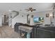Spacious living room with sectional sofa and large TV at 209 Sofia Ln, Lake Alfred, FL 33850