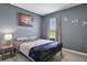 Cozy bedroom with a double bed and calming wall art at 209 Sofia Ln, Lake Alfred, FL 33850