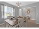 Dining room with table, chairs, and access to the foyer at 209 Sofia Ln, Lake Alfred, FL 33850