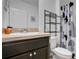 Clean bathroom with a vanity, toilet, and shower at 209 Sofia Ln, Lake Alfred, FL 33850