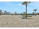 Relaxing pool area with palm trees and ample space at 209 Sofia Ln, Lake Alfred, FL 33850