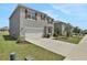 Two-story house with gray siding, red shutters, and white garage door at 209 Sofia Ln, Lake Alfred, FL 33850