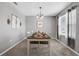 Bright dining room with a table set for four and decorative wall accents at 209 Sofia Ln, Lake Alfred, FL 33850