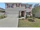 Two-story house with gray siding and red shutters at 209 Sofia Ln, Lake Alfred, FL 33850