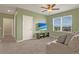 Bonus room with a sofa, TV, and ceiling fan at 209 Sofia Ln, Lake Alfred, FL 33850