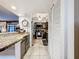 Gray kitchen with granite countertops, stainless steel appliances, and ample cabinet space at 100 E Oak Terrace Dr # G1, Leesburg, FL 34748