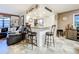 Kitchen features a breakfast bar with seating and granite countertops at 100 E Oak Terrace Dr # G1, Leesburg, FL 34748