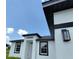 Modern home exterior with black and white color scheme at 1300 Hillsborough Ct, Kissimmee, FL 34759