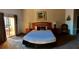 Spacious Primary bedroom with king-size bed and private balcony at 113 Rogues Retreat, Davenport, FL 33897