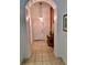 Bright entryway with tile flooring, arched entry, and a console table at 113 Rogues Retreat, Davenport, FL 33897