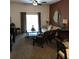 Living room with comfy seating, a coffee table, and large windows at 113 Rogues Retreat, Davenport, FL 33897