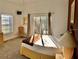 Bright bedroom with a queen-size bed and access to balcony at 113 Rogues Retreat, Davenport, FL 33897