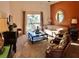 Living room with comfy seating, a coffee table, and large windows at 113 Rogues Retreat, Davenport, FL 33897