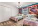 bedroom with twin beds and Monsters University theme at 1128 Kingsbarn St, Davenport, FL 33896