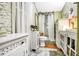 Clean bathroom with shower, toilet, and white cabinets at 2301 Ne 97Th Street Rd, Anthony, FL 32617