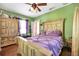 Bedroom with light wood furniture, and lavender bedding at 2301 Ne 97Th Street Rd, Anthony, FL 32617