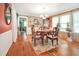 Elegant dining room featuring hardwood floors, a chandelier, and antique furniture at 2301 Ne 97Th Street Rd, Anthony, FL 32617