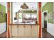 Updated kitchen with white cabinets, terracotta countertops and a breakfast bar at 2301 Ne 97Th Street Rd, Anthony, FL 32617