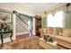 Spacious living room with staircase, hardwood floors and decorative accents at 2301 Ne 97Th Street Rd, Anthony, FL 32617