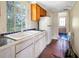 Small kitchen with white cabinets and a double sink at 2301 Ne 97Th Street Rd, Anthony, FL 32617