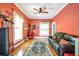 Bright living room with hardwood floors, a leather couch, and large windows at 2301 Ne 97Th Street Rd, Anthony, FL 32617