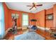 Room with hardwood floors, exercise equipment, and orange walls at 2301 Ne 97Th Street Rd, Anthony, FL 32617