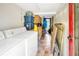 Laundry room with washer, dryer, and extra storage at 2301 Ne 97Th Street Rd, Anthony, FL 32617