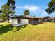 Single-story home with a spacious yard and screened porch at 110 Lindenwood Ln, Kissimmee, FL 34743