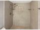 Large walk in shower with tiled walls and built-in shelving at 110 Lindenwood Ln, Kissimmee, FL 34743