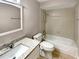 Bathroom features a bathtub, toilet and granite vanity at 110 Lindenwood Ln, Kissimmee, FL 34743